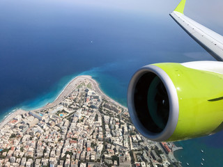 Bombardier CS300 aircraft turbine is flying over Rhodes island