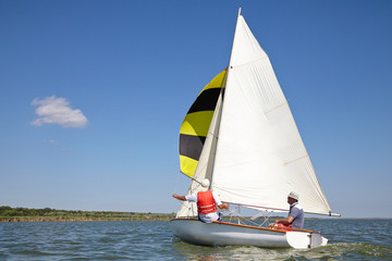 Two man drive a sport sailing yacht, Close-up view of the cockpit