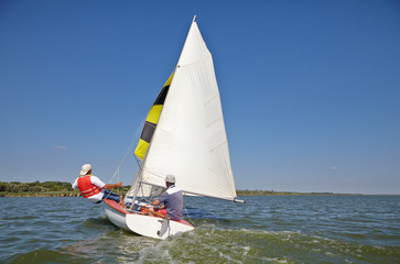 Two man drive a sport sailing yacht, Close-up view of the cockpit