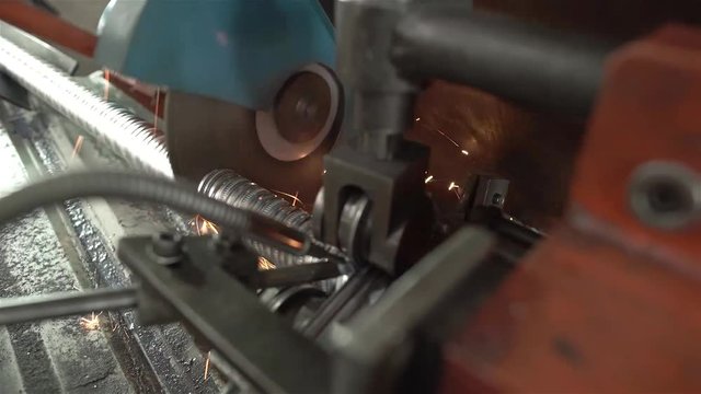 Aluminum Duct Pipes Being Cut On Machine With Sparks - Close Up 