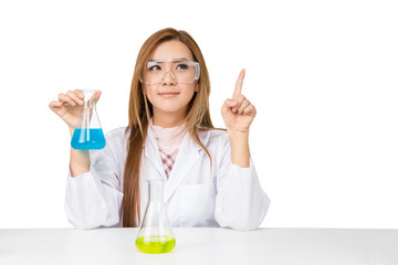 Asian scientific researcher holding at a liquid solution in a lab