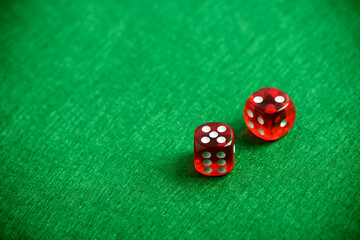 Red poker dices on casino table