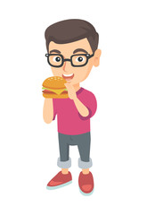 Little caucasian boy eating a hamburger with appetite. Cheerful boy in glasses holding a big hamburger. Vector sketch cartoon illustration isolated on white background.