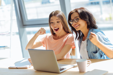 Happy delighted women expressing their emotions