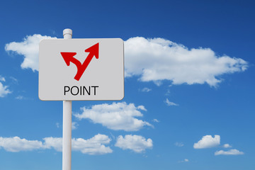 blue sky and a point sign