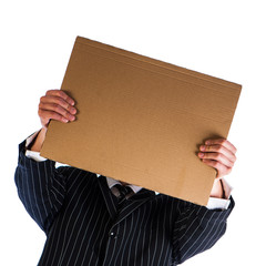 Businessman holding a cardboard sheet of paper