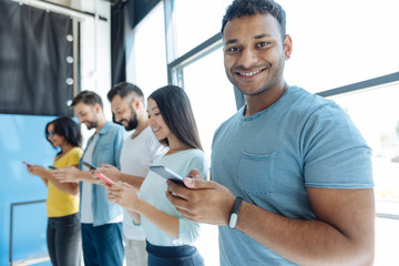 Handsome young man looking at you