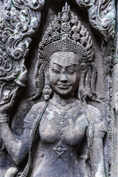Detail of stone carvings of Apsara is a beautiful and seductive girl of Hindu mythology at Angkor Wat, Cambodia