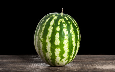 Watermelon on old wooden surface