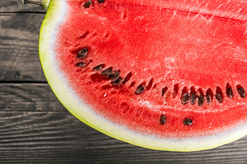 Watermelon on old wooden background