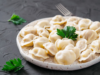 Russian pelmeni, ravioli, dumplings with meat