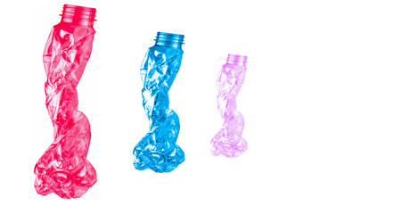 Red, blue and pink twisted plastic bottles are shaped like three people walking in a row on white...