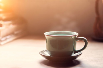 cup of dusty on desk.
