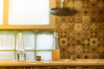 Shampoo and liquid soap with blur bathroom  background .