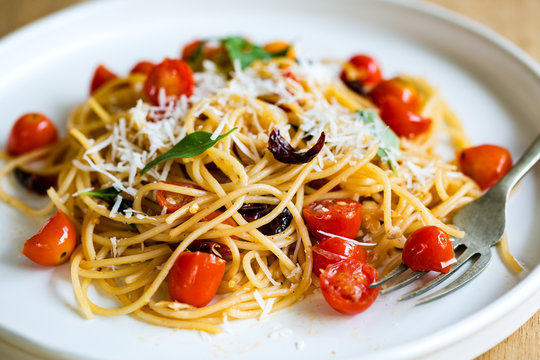Spaghetti with Cherry tomatoes and dried chili with grated Parmesan