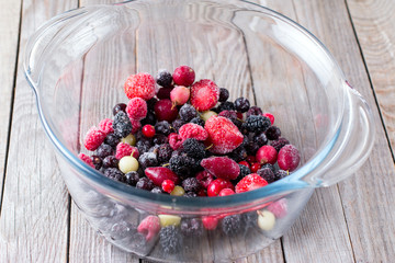 Frozen berries in a glass bowl