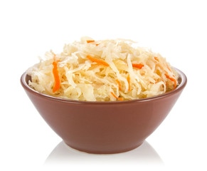 Pickled cabbage in ceramic pan isolated on white background.