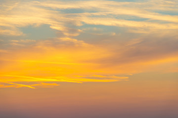 Clouds in a blue sky at sunset in summer