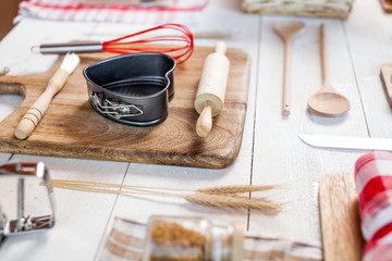 Bakery utensils. Kitchen tools for baking on a rustic wooden table.