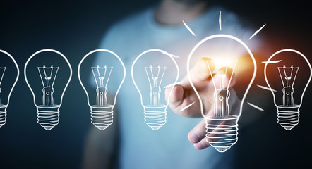 Businessman touching a sketch lightbulb