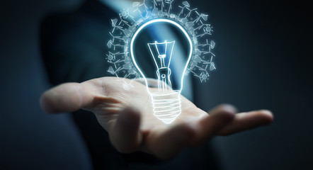 Businessman holding renewable eco lightbulb sketch