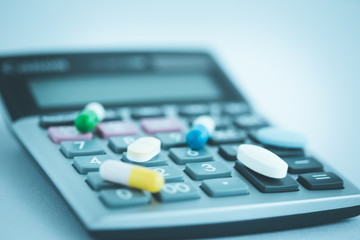 CALCULATOR WITH PILLS CONCEPT