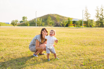 Fototapeta premium concept of family - mother and child son outdoors in summer