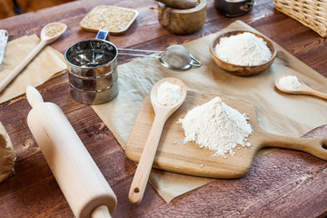 Fototapeta na wymiar wheat and flour on rustic wooden table