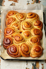 Honey cinnamon buns on baking tray