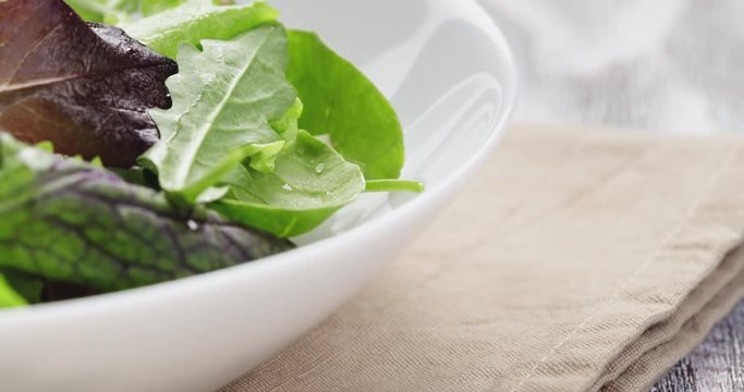 mesclun mix salad in white bowl