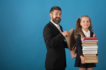 Girl in uniform and bearded man. Back to school concept