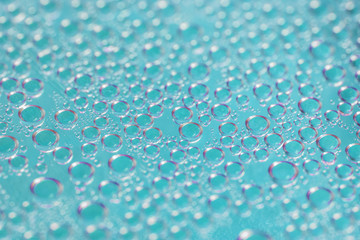 Condensate. Blue water drops background. Selective focus, close-up