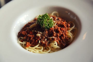 Spaghetti bolognese in dark tone