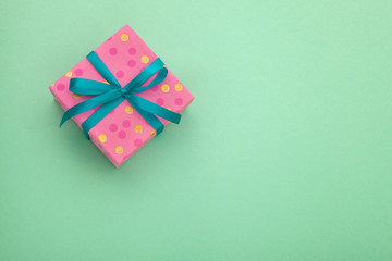 Craft paper pink gift box with as a present for Christmas, new year, valentine day or anniversary...