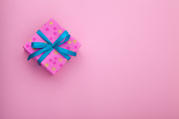 Craft paper pink gift box with as a present for Christmas, new year, valentine day or anniversary on beautiful background, top view, mock up