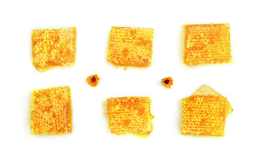 Honeycombs with honey and orange flowers on a white background. Top view, flat lay