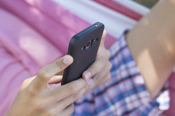 hands closeup with mobile phone