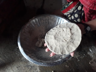 Indian woman making pearl millet chapatti 3