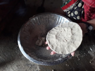 Indian woman making pearl millet chapatti 1