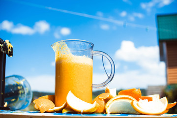 Squeezed orange juice and fresh oranges fruits