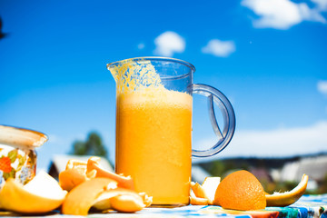 Squeezed orange juice and fresh oranges fruits