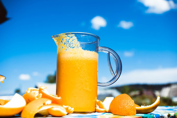 Squeezed orange juice and fresh oranges fruits