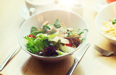 close up of caesar salad on plate at restaurant