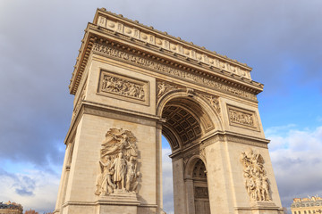 Fototapeta na wymiar PARIS, FRANCE : The Arc de Triomphe de l'Etoile is one of the most famous monuments, View of the Champs-Elysees Avenue is full of stores, cafes and restaurants.