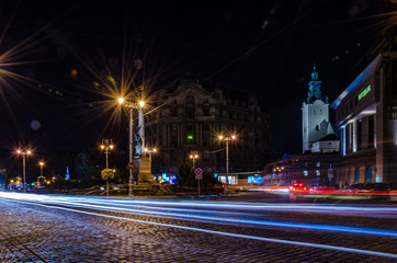 Naklejka na ściany i meble Night Lviv cityscape with long exposure in Ukraine