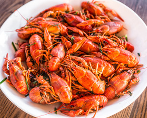 Full plate of boiled crayfishes. Top view.