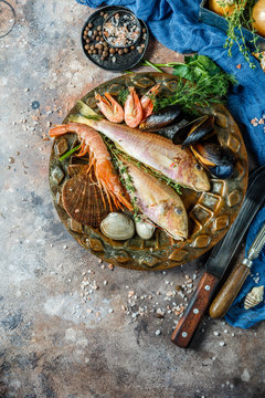 Seafood on table with knives