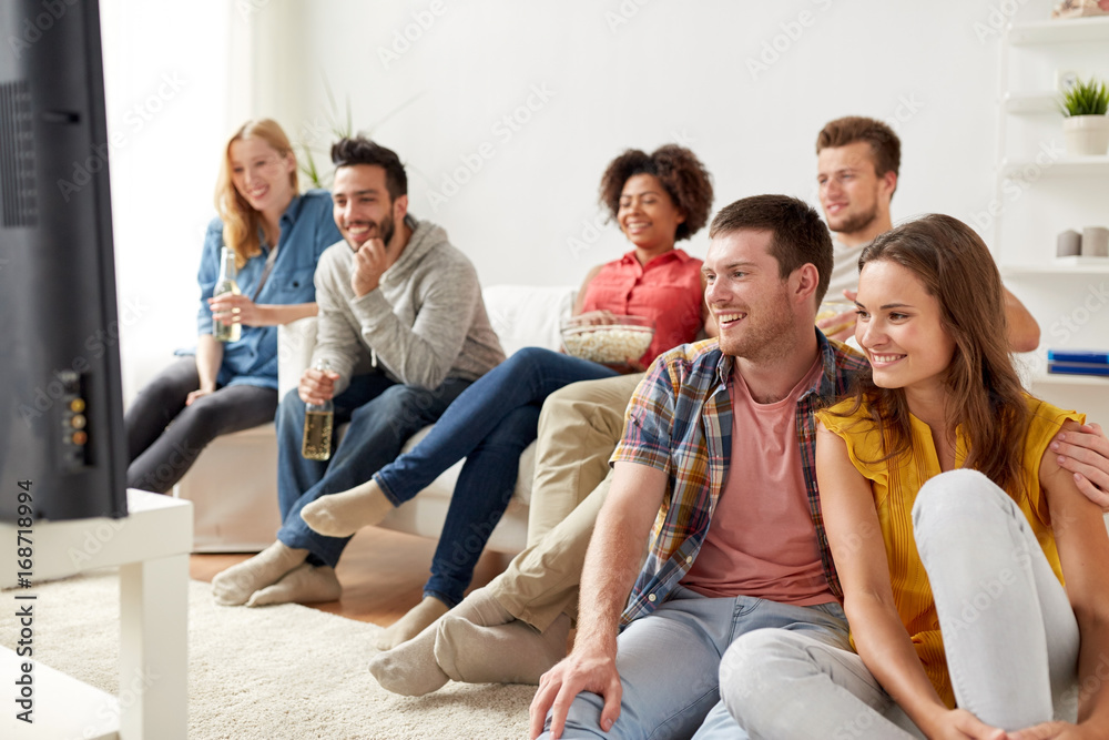 Canvas Prints happy friends with popcorn watching tv at home