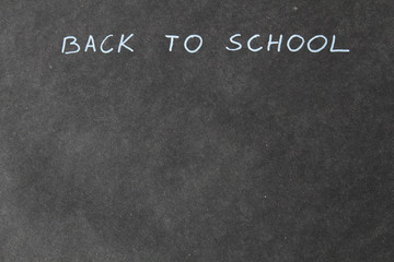 Fototapeta na wymiar Hand writing back to school. Blackboard