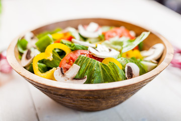 vegetable salad bowl on kitchen table, balanced diet